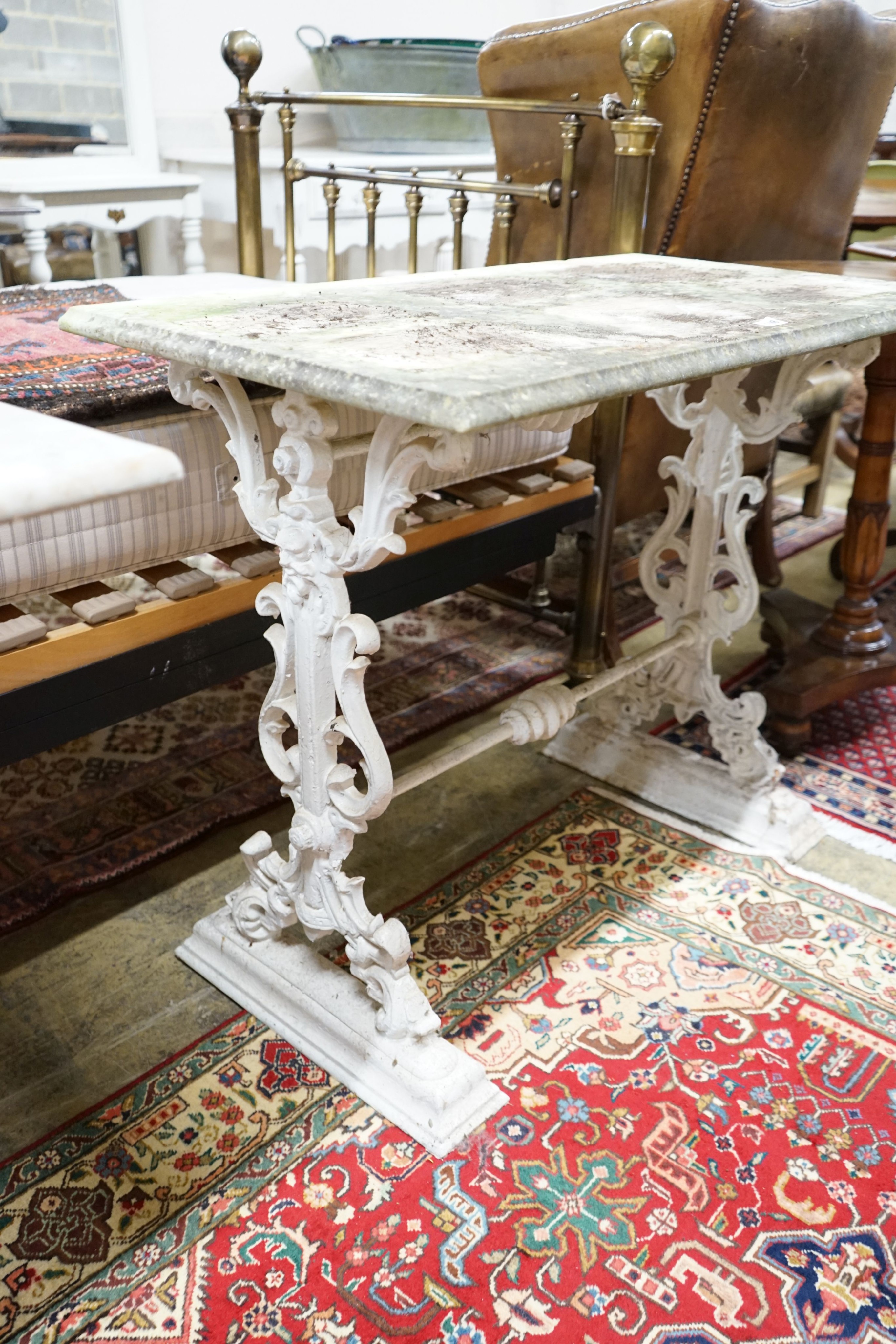 A Victorian cast iron rectangular marble topped garden table, width 91cm, depth 50cm, height 74cm